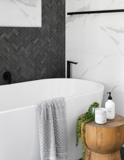 black tile and white granite walls bathroom